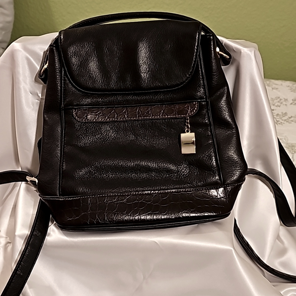Carriage House two-toned leather backpack purse. No signs of wear or tear.